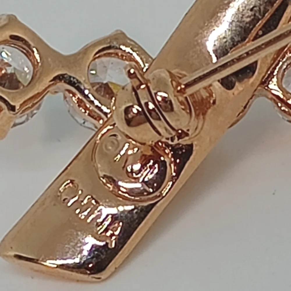 * Kenneth Jay Lane Rose Gold Tone Breast Cancer Ribbon Pin Brooch